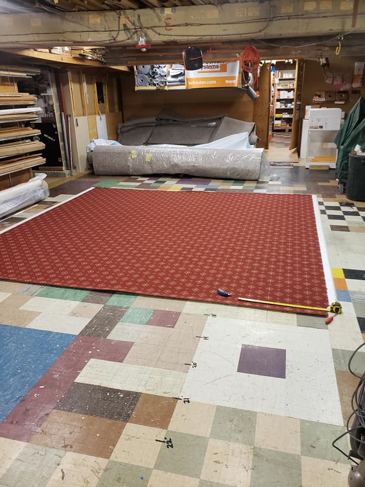 Cutting of red pattern carpet remnant
