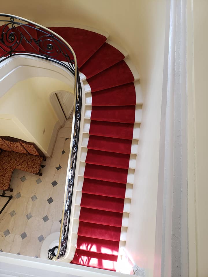 Red luxury carpet runner on grand staircase in Glen Manor House