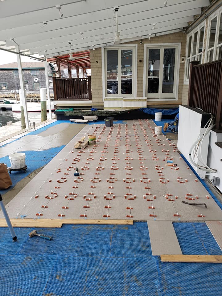 Patio tile installation in progress at The Mooring Seafood Kitchen & Bar