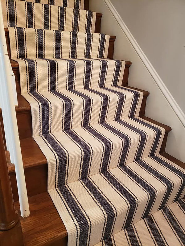 Blue awning lined stair runner installed