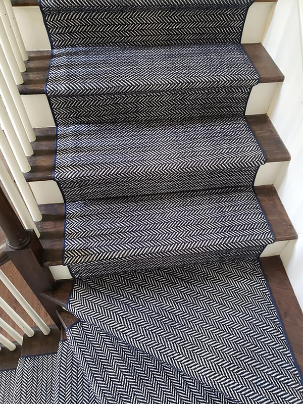 Finished installation of herringbone stair runner close up