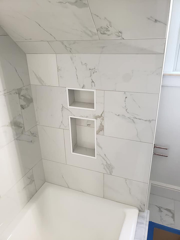 Close up of detailed marble around shower niche