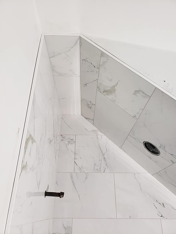 Detail and precision of angle tile cuts for shower and ceiling